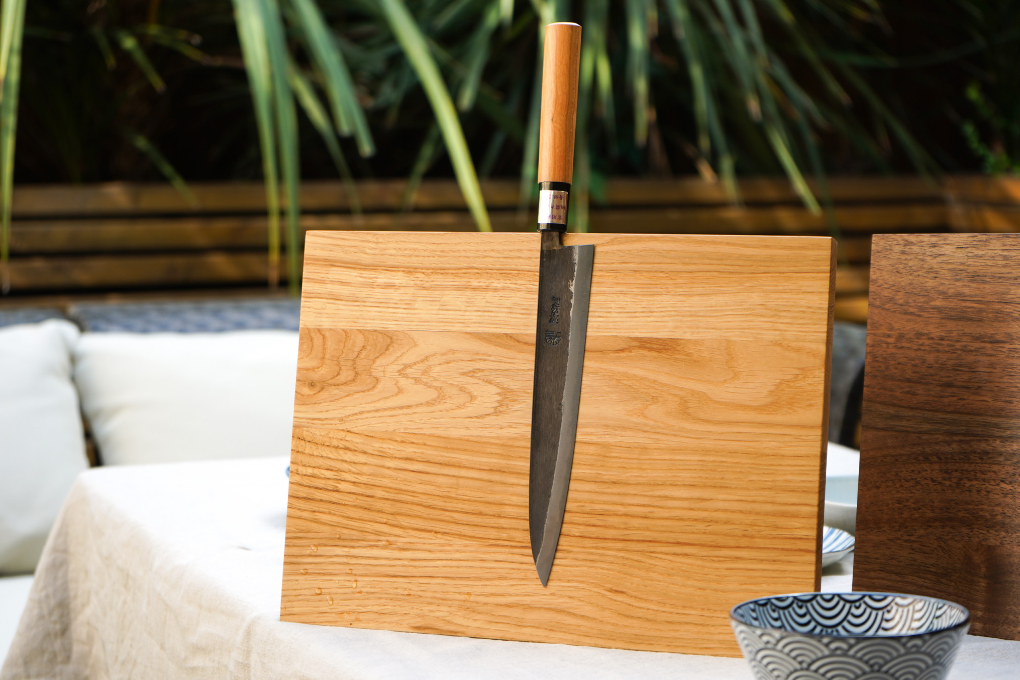 Moritaka Gyuto 210mm AS featuring our signature magnetic knife stand in oak
