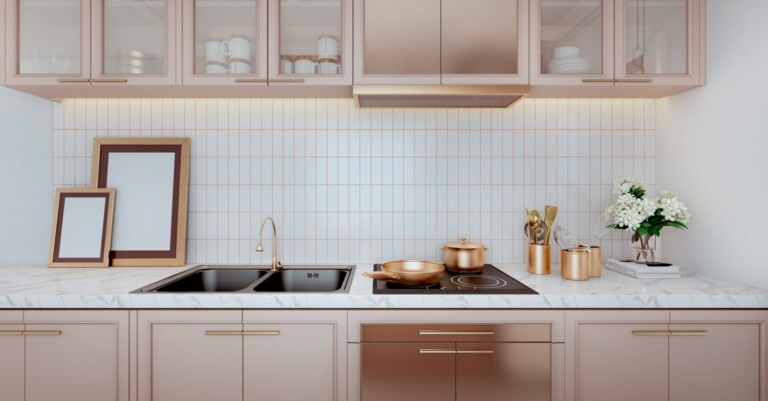 Rose gold color kitchen interior with a tiled wall,white countertops.A close up.3d rendering mock up