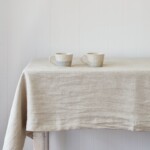 tablecloth on table with mugs