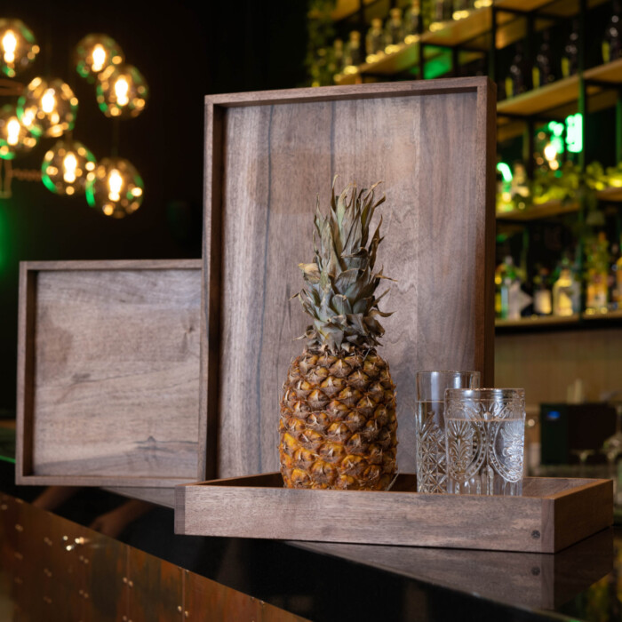 walnut wooden trays in a bar