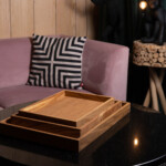 oak wooden coffee tray in three sizes on a livingroom table