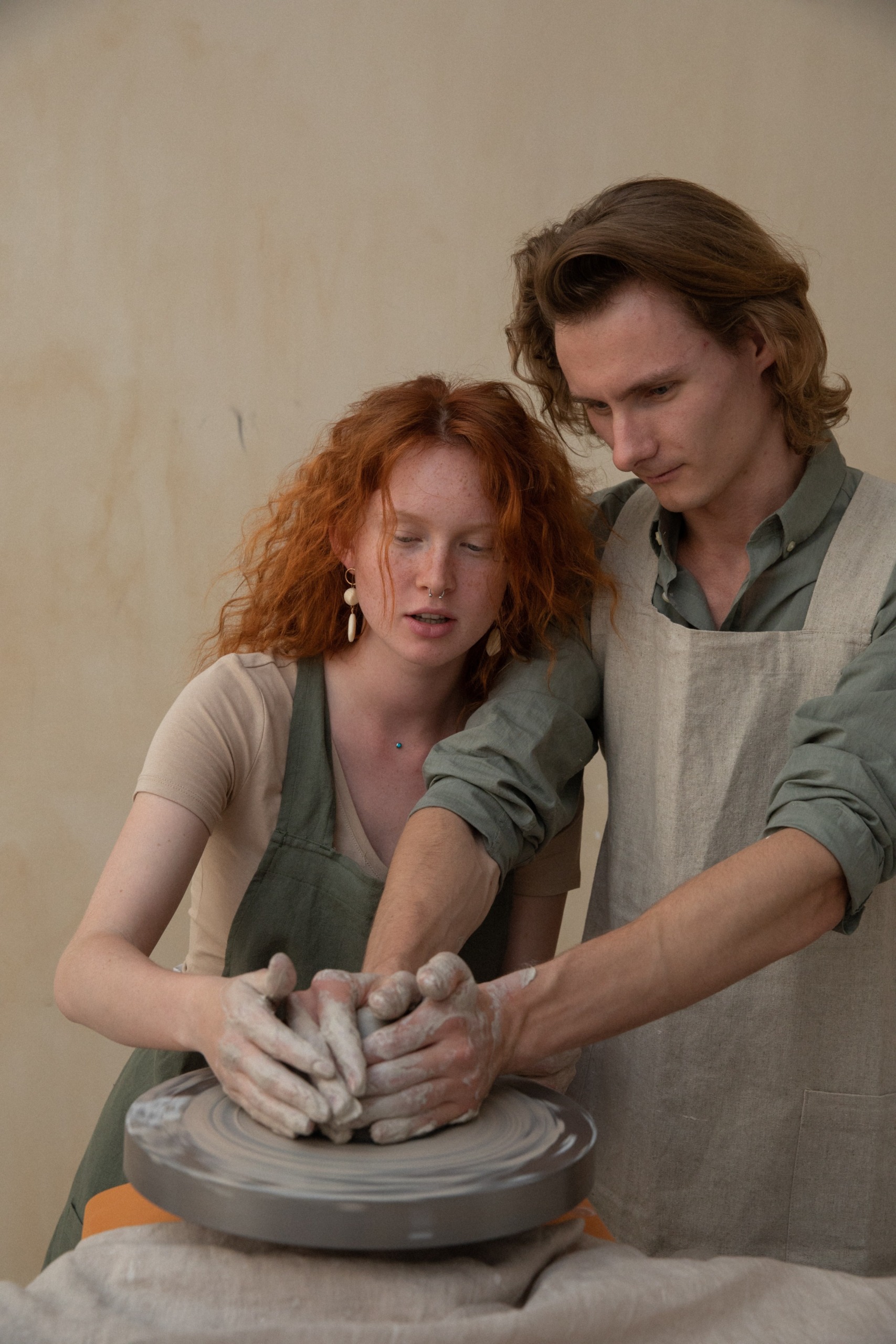 Couple making pottery together