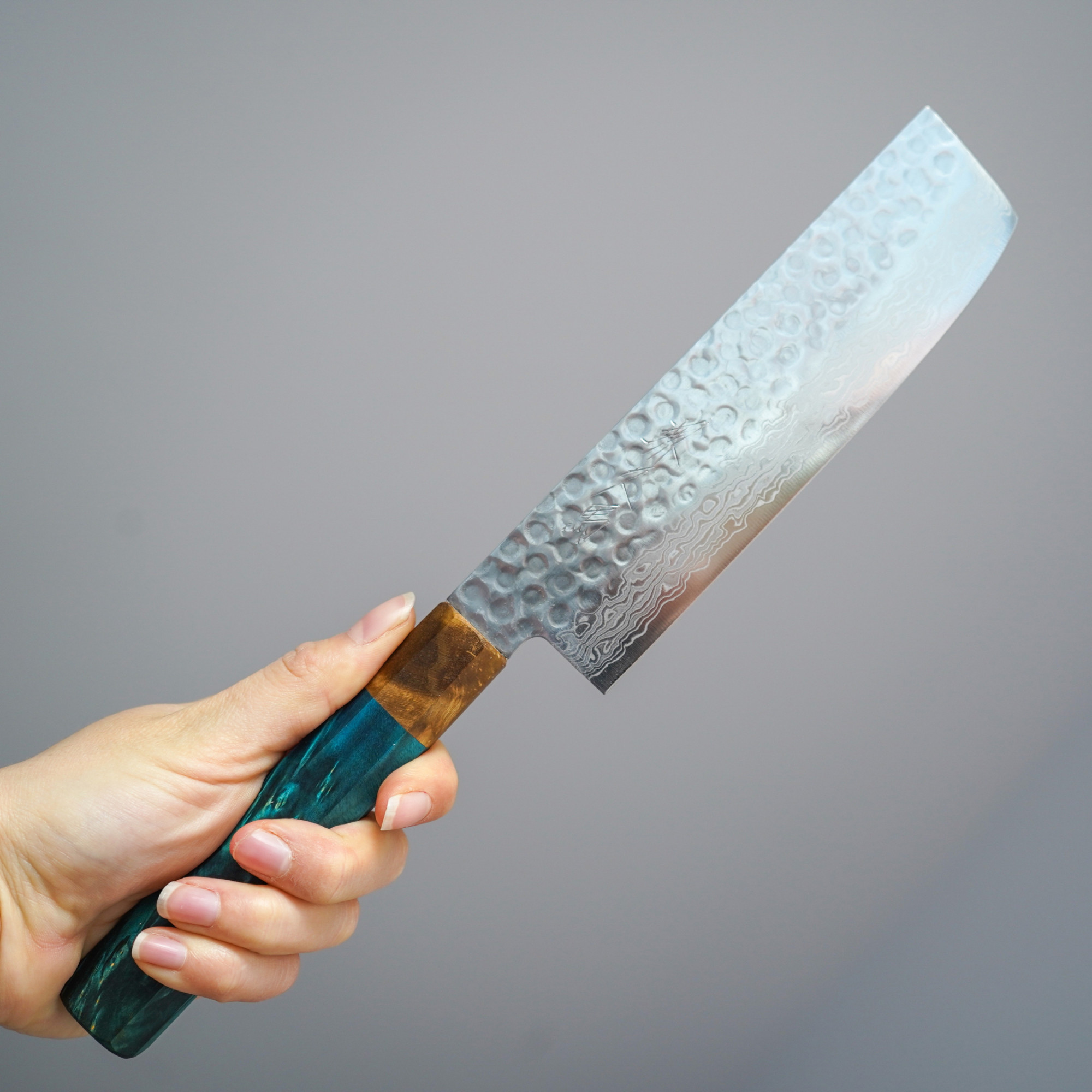 Sakai Kyuba – Vegetable Knife 16cm – The Nakiri with Mediterranean Blue handle held by hand