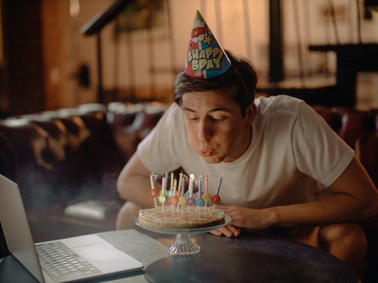 Man blowing birthday candles