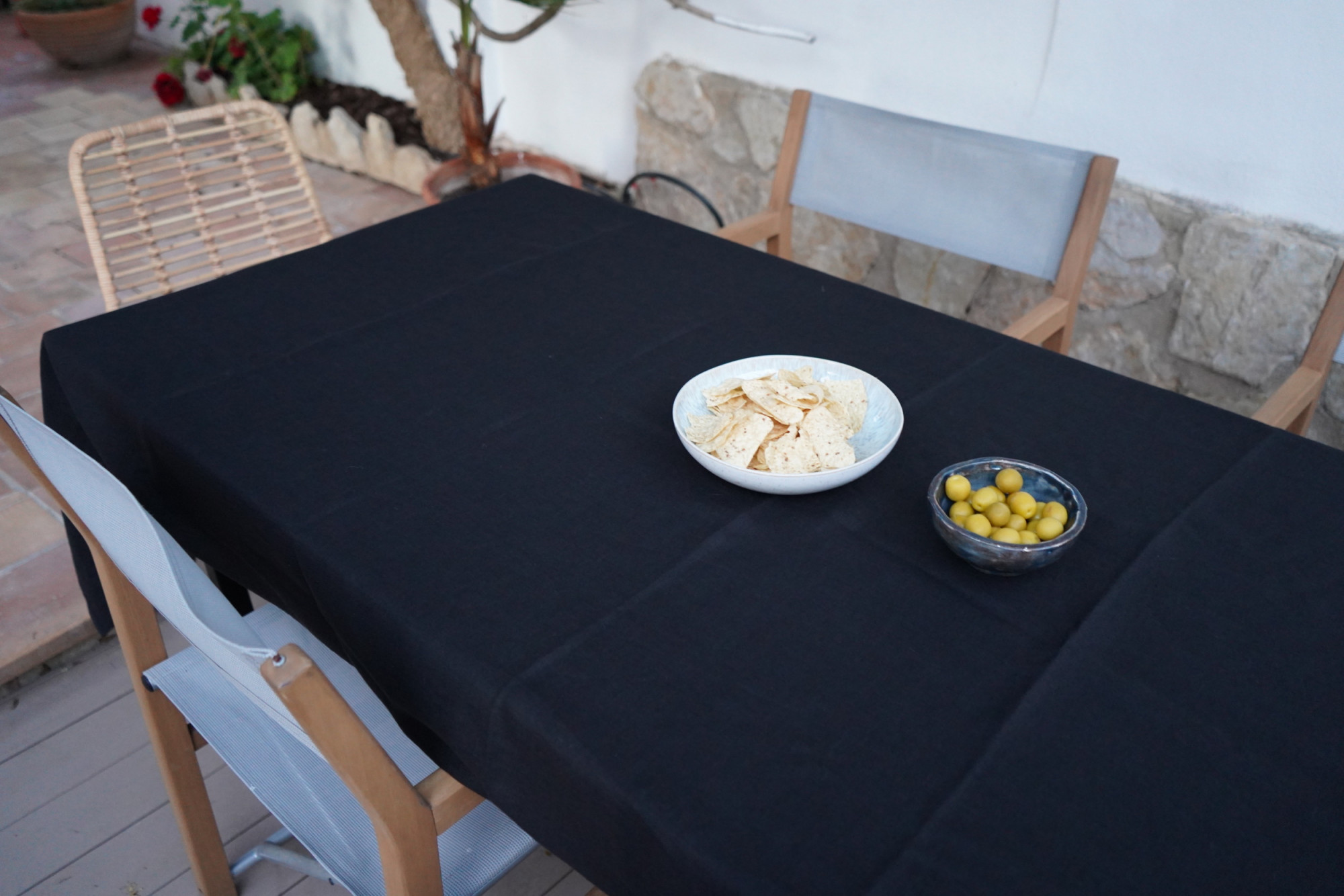Linen Tablecloth Stonewashed – Off Black, on outdoors table