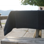 Linen Tablecloth Stonewashed – Off Black, on outdoors table kamon logo