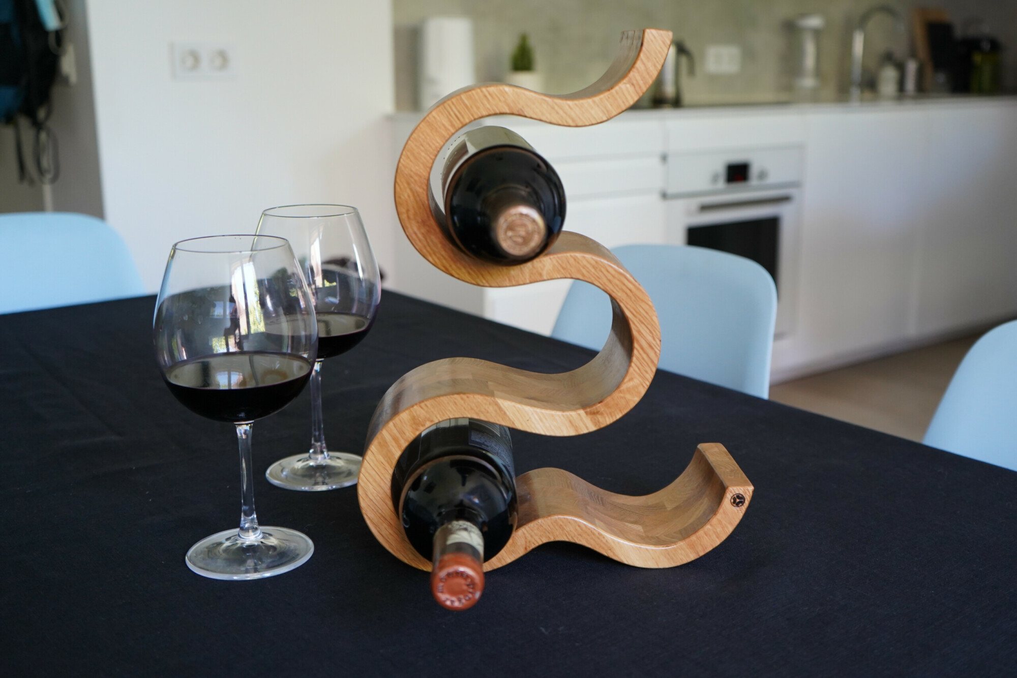 Wooden Wine Rack x 5 Bottles The Wave – Oak, on table with wine glasses