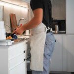 Man wearing Kitchen Apron in natural, cooking