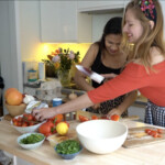 Smiling women using Sakai Kyuba knives in cooking party